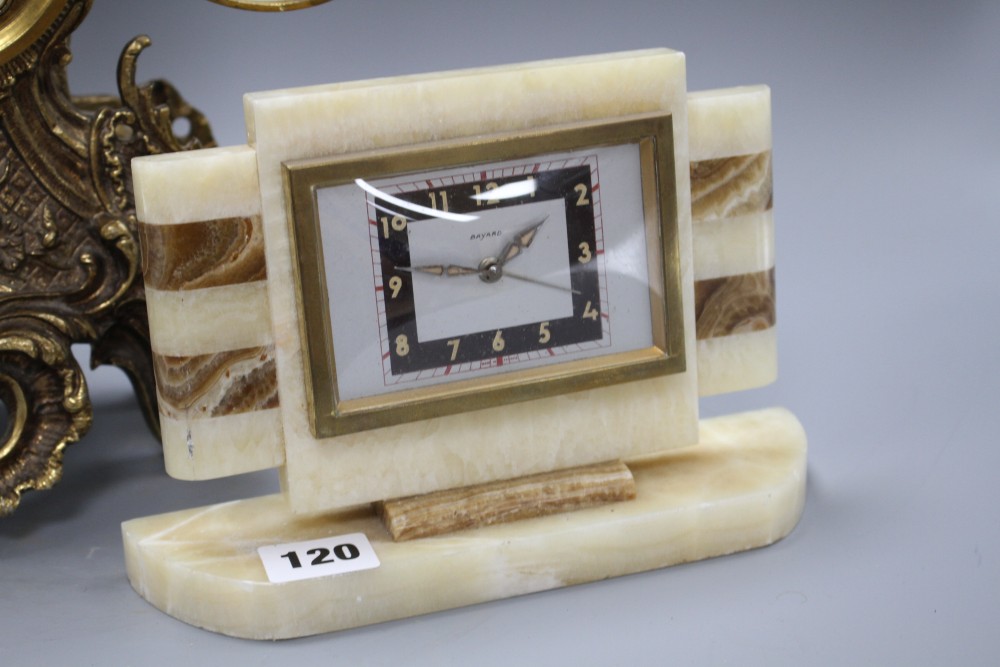 A Bayard two colour onyx mantel timepiece, height 15cm and a gilt metal mantel timepiece, height 42cm